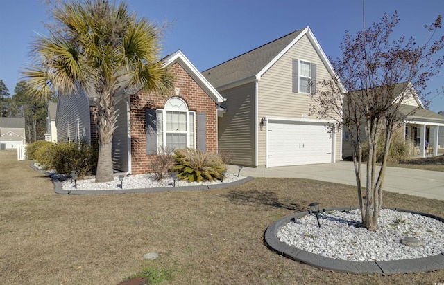 view of property with a garage and a front lawn