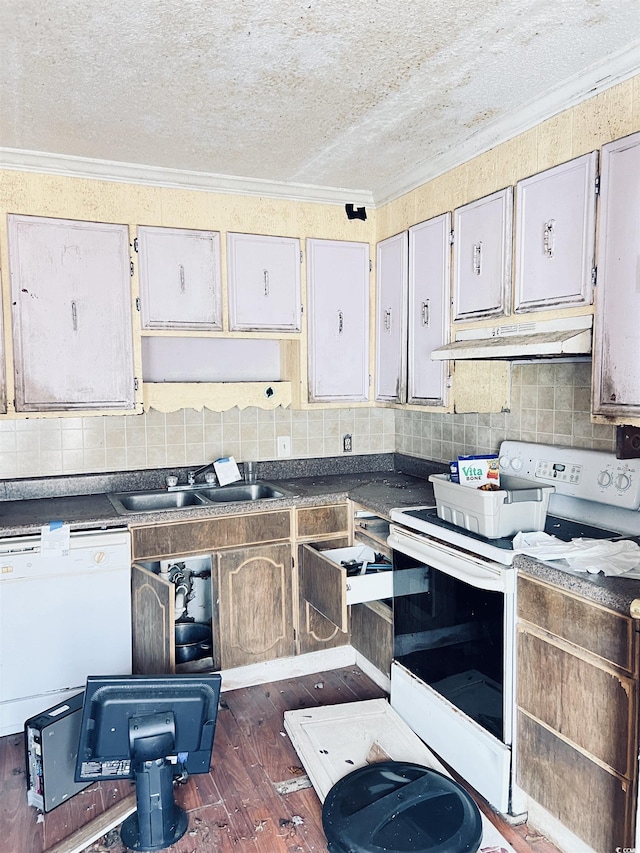 kitchen featuring dark hardwood / wood-style floors, sink, ornamental molding, white appliances, and a textured ceiling