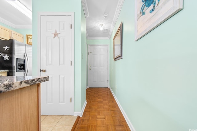 hallway with crown molding and light parquet flooring