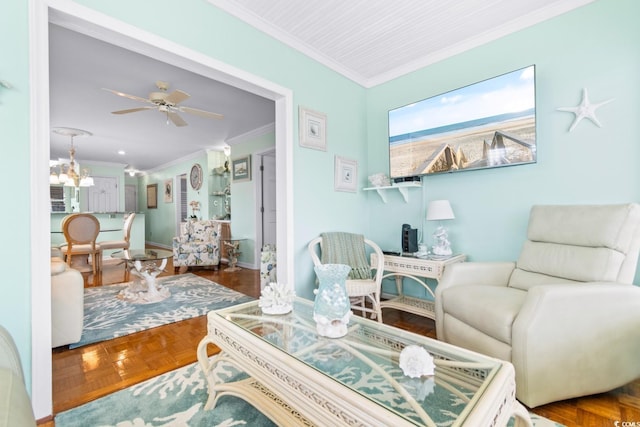 sitting room with crown molding, parquet flooring, and ceiling fan with notable chandelier