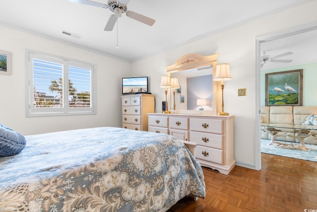 bedroom featuring light parquet floors, crown molding, and ceiling fan