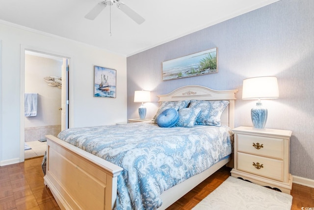 bedroom featuring crown molding, ensuite bath, dark parquet floors, and ceiling fan