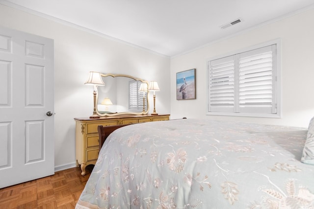 bedroom featuring ornamental molding and light parquet flooring