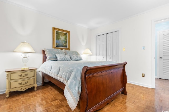 bedroom featuring crown molding, a closet, and light parquet flooring