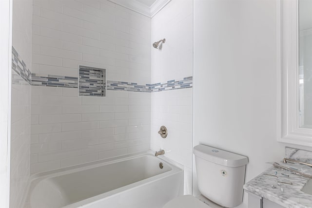 bathroom featuring toilet, vanity, and bathing tub / shower combination