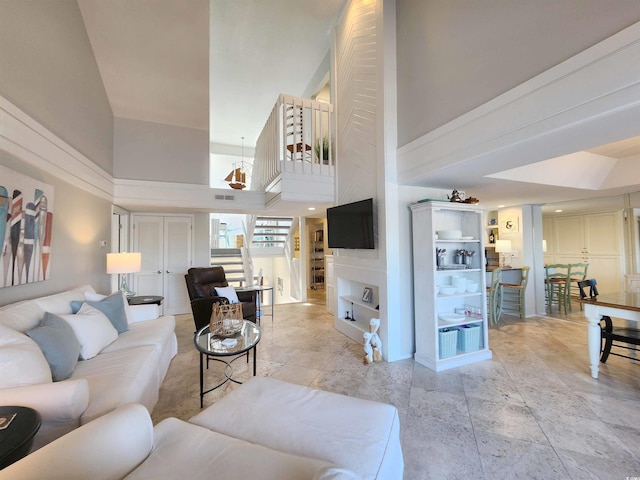 living room featuring a towering ceiling