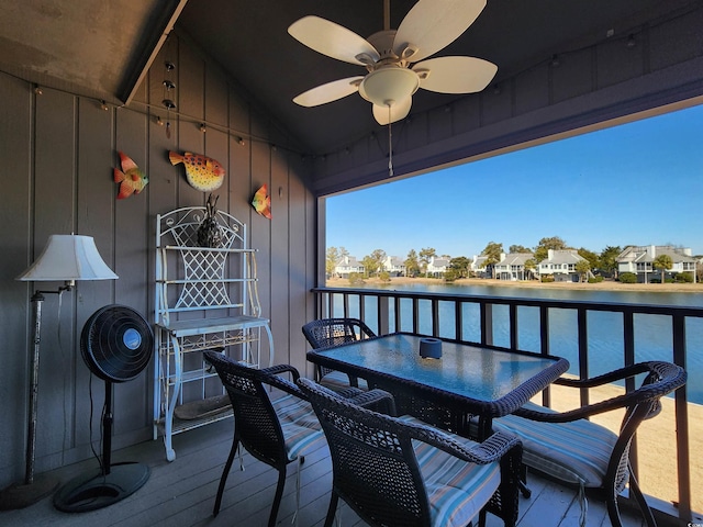 exterior space featuring a water view and ceiling fan