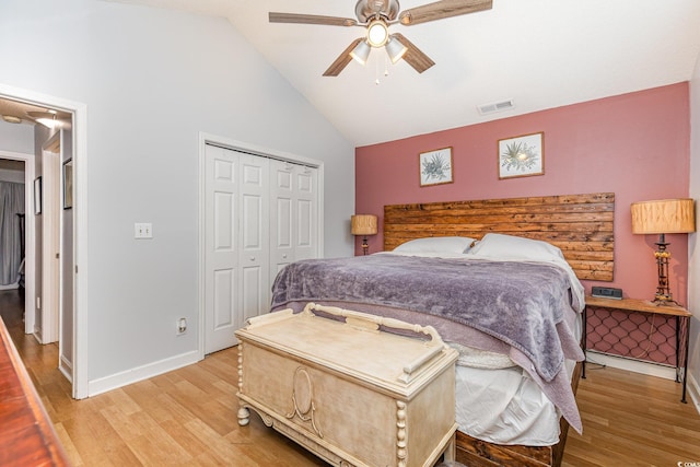 bedroom with baseboards, light wood-style flooring, visible vents, and a closet