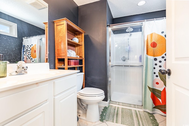 bathroom with a textured ceiling, toilet, vanity, a shower stall, and tile patterned floors