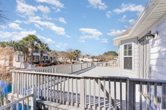 deck featuring a water view and a residential view