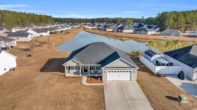 aerial view featuring a residential view and a water view