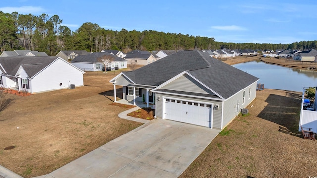 birds eye view of property featuring a residential view and a water view