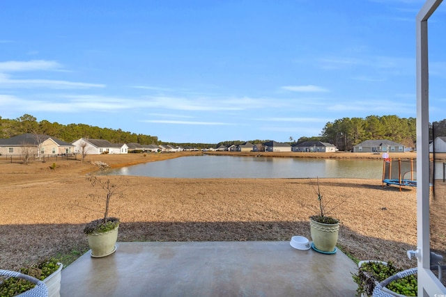 exterior space with a water view and a trampoline