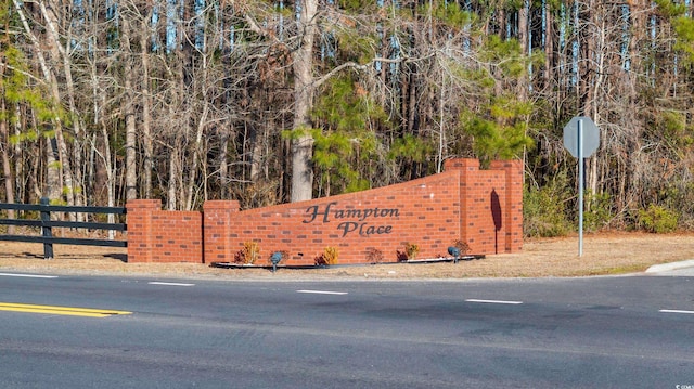 community sign with fence