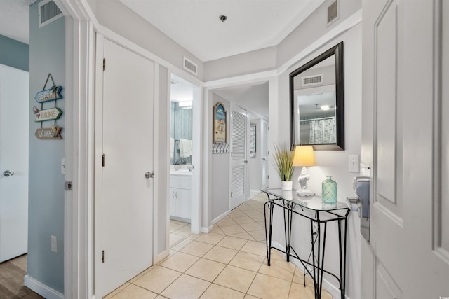 108 Rothbury Cir Unit 207, Myrtle Beach, SC 29572 - corridor with a sink, light tile patterned floors, and baseboards