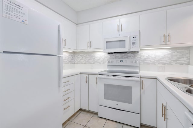 108 Rothbury Cir Unit 207, Myrtle Beach, SC 29572 - kitchen with white appliances, white cabinetry, light countertops, and backsplash