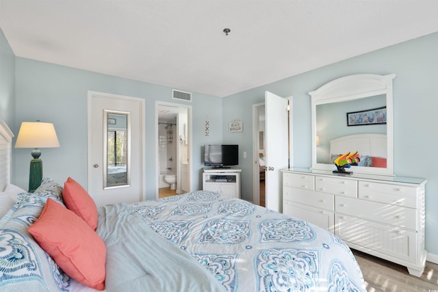 108 Rothbury Cir Unit 207, Myrtle Beach, SC 29572 - bedroom with wood finished floors, ensuite bathroom, and baseboards