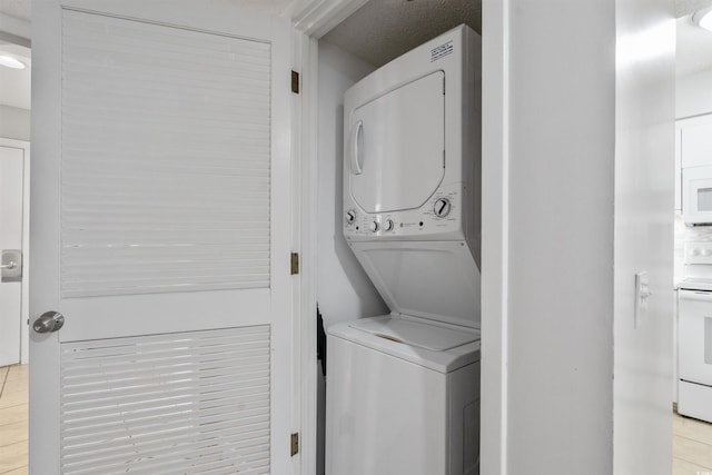 108 Rothbury Cir Unit 207, Myrtle Beach, SC 29572 - washroom featuring estacked washer and dryer and light tile patterned flooring