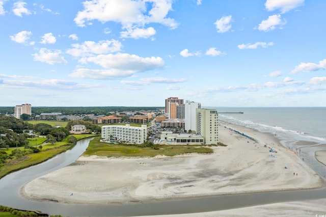 birds eye view of property with a beach view and a water view