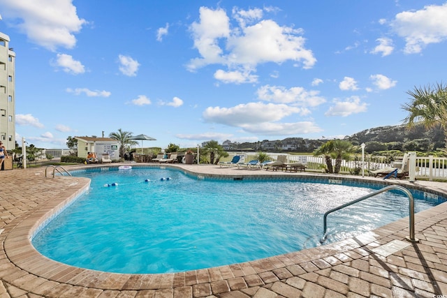 view of swimming pool with a patio