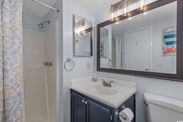 bathroom featuring vanity, a textured ceiling, and a shower with shower curtain