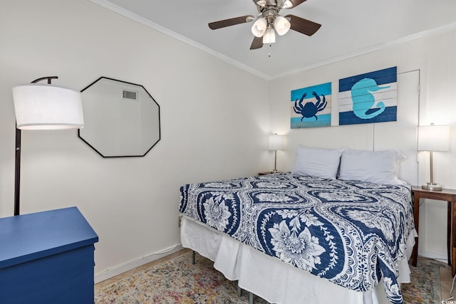 bedroom featuring ceiling fan and ornamental molding