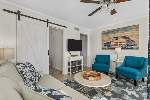 tiled living room with crown molding, a barn door, and ceiling fan