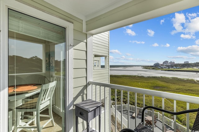 balcony featuring a water view