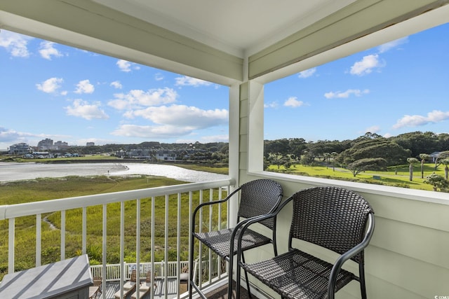 balcony featuring a water view