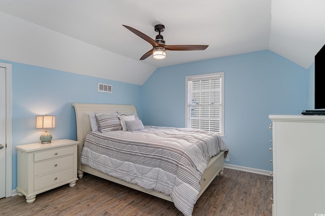 bedroom featuring ceiling fan, lofted ceiling, and dark hardwood / wood-style flooring