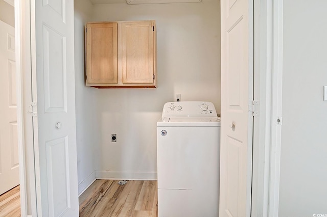 washroom with cabinets, washer / dryer, and light hardwood / wood-style floors