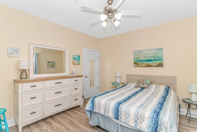 bedroom with light hardwood / wood-style floors and ceiling fan