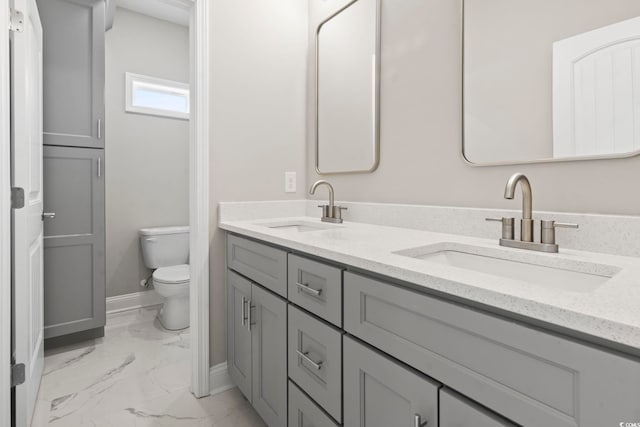 bathroom featuring vanity and toilet