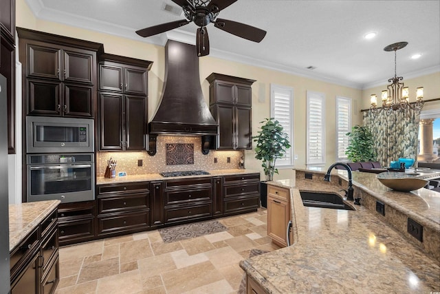 kitchen featuring sink, ornamental molding, custom range hood, stainless steel appliances, and decorative backsplash