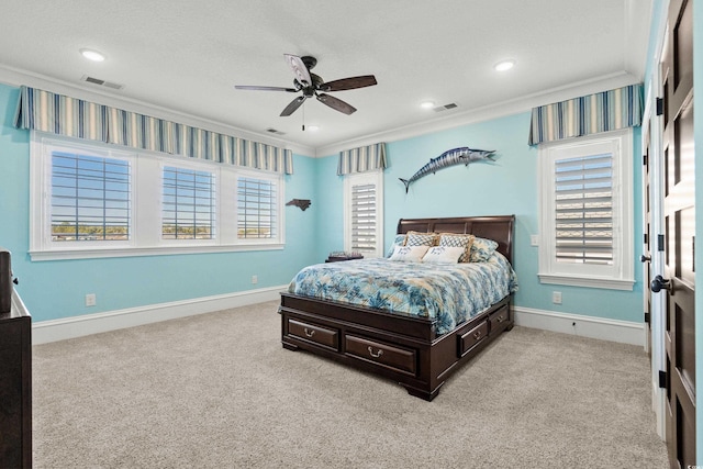 carpeted bedroom with multiple windows, ornamental molding, and ceiling fan