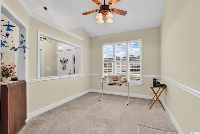 empty room featuring baseboards, ornamental molding, a ceiling fan, and light colored carpet