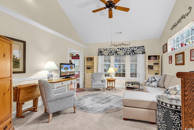 living area featuring ceiling fan, high vaulted ceiling, light carpet, visible vents, and baseboards