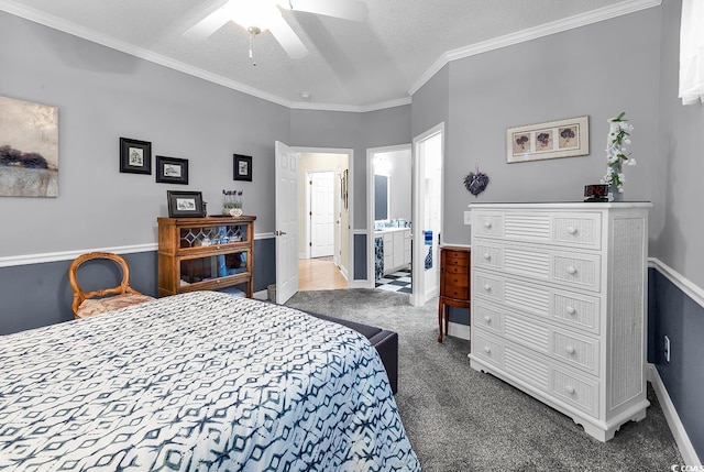 carpeted bedroom featuring ornamental molding, a ceiling fan, connected bathroom, a textured ceiling, and baseboards