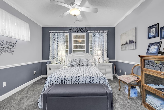 bedroom with a textured ceiling, a ceiling fan, baseboards, ornamental molding, and dark colored carpet