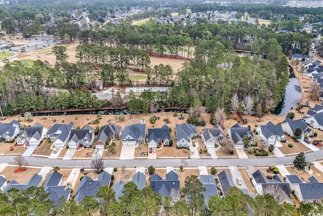 drone / aerial view with a water view and a residential view