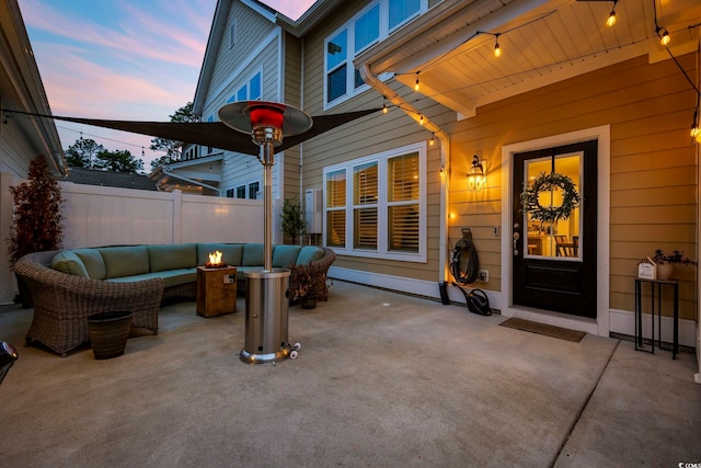 patio terrace at dusk with an outdoor hangout area