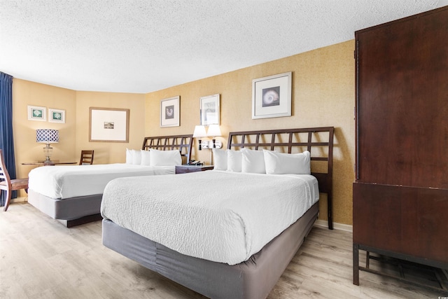2700 N Ocean Blvd Unit 253, Myrtle Beach, SC 29577 - bedroom featuring wood finished floors and a textured ceiling