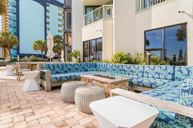 2700 N Ocean Blvd Unit 253, Myrtle Beach, SC 29577 - view of patio featuring an outdoor living space with a fire pit