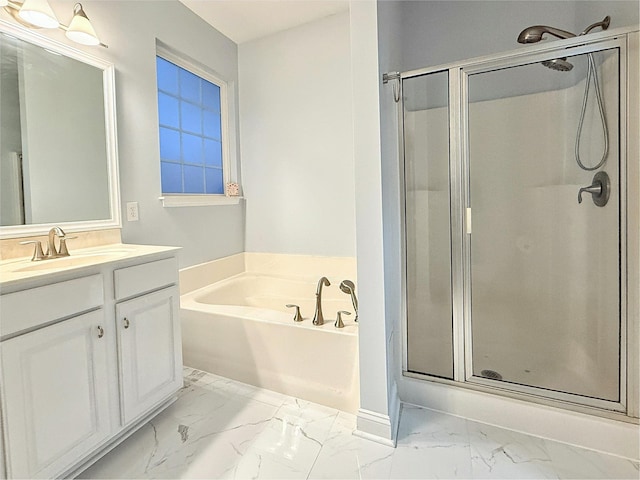 bathroom featuring vanity and independent shower and bath