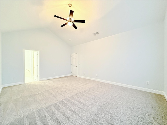 carpeted empty room with lofted ceiling and ceiling fan