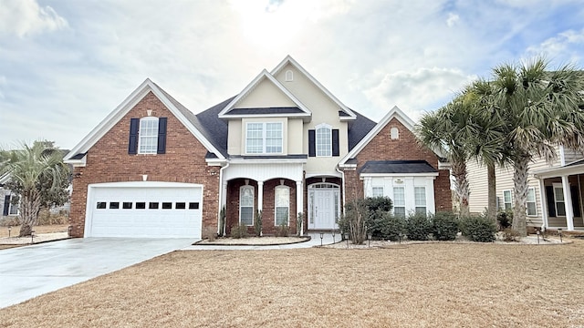 view of front facade with a garage and a front yard