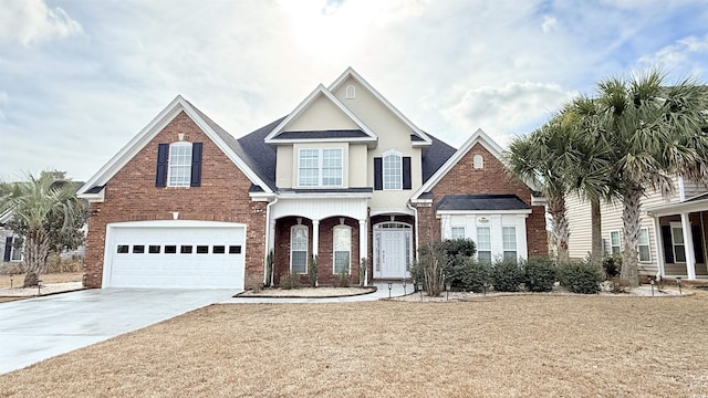 view of front of house featuring concrete driveway, brick siding, and a garage