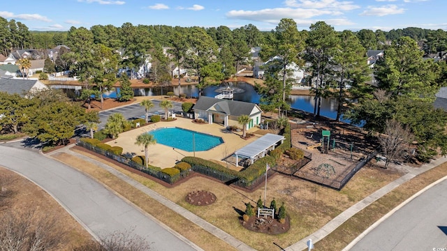 view of pool with a water view