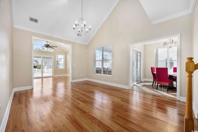 interior space with crown molding, high vaulted ceiling, ceiling fan with notable chandelier, and hardwood / wood-style floors