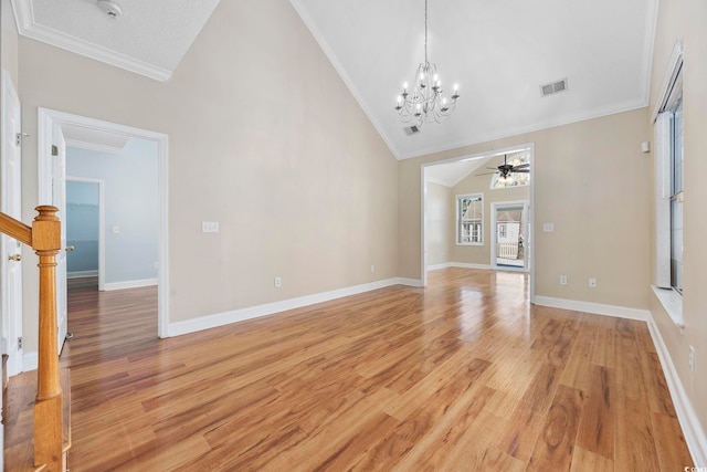 unfurnished living room with crown molding, light hardwood / wood-style flooring, high vaulted ceiling, and ceiling fan with notable chandelier